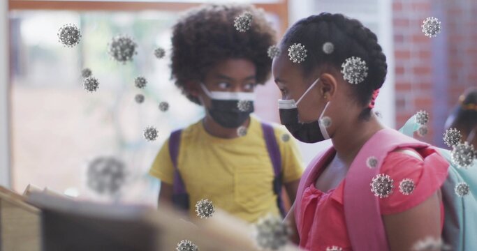 Standing two students wearing face masks at school counter, showing pink backpack and virus overlay
