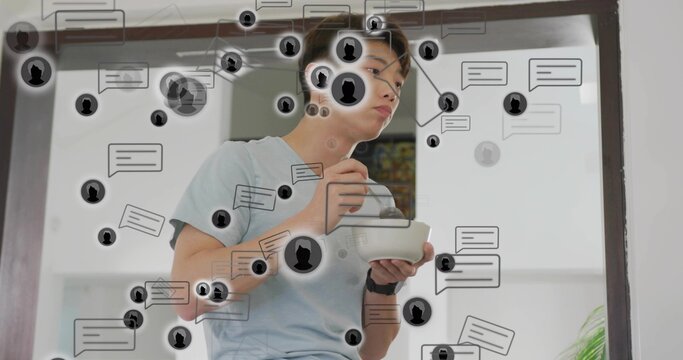 Holding bowl spoon, Korean teen standing at doorway in light blue tee, dark watch, chat bubbles