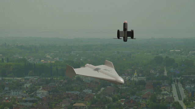 An interceptor drone and a combat drone against a city backdrop, on the topic of drone interception