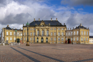 Facade of one of the Amalienborg Palace buildings on Royal Square, Copenhagen, Denmark. Historic Rococo architecture © borisb17
