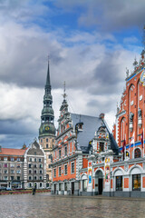 Fototapeta premium Town Hall Square with House of the Blackheads and St Peters Church tower, Riga, Latvia. Historic architecture in winter