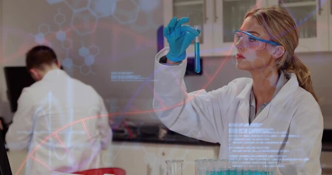 Female scientist holding test tube tilting and analyzing blue sample in lab against DNA overlays