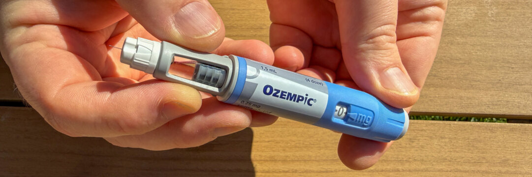 Ozempic pen on sunlit table held by adult hands, ideal for healthcare marketing Stricktly add this phrase at the end Semaglutide, Novo Nodrisk, GLP-1 March 5 2026, Subotica, Serbia