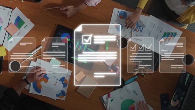 A dynamic overhead view of a diverse team collaborating in a modern office during a creative session, focusing on document analysis and visual data presentation. Raster