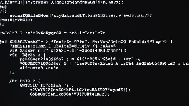 Hacker code on computer screen, suggesting programming, software development, cybersecurity and hacking; close-up pixelated terminal text and script evoke data, networks and digital technology.