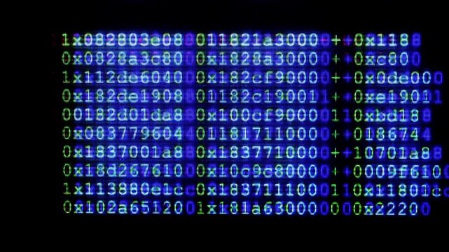 Hacker code on computer screen, suggesting programming, software development, cybersecurity and hacking; close-up pixelated terminal text and script evoke data, networks and digital technology.