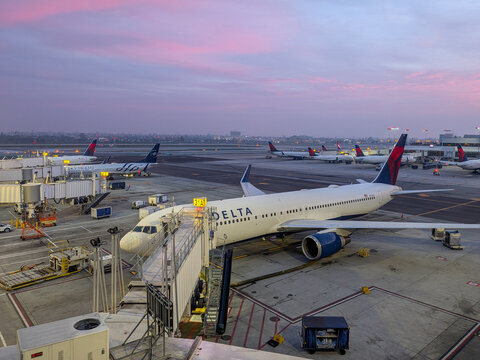 Los Angeles, CA - March 13, 2026:  Delta planes viewed at sunrise at LAX