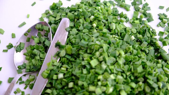 Chopped fresh ripe scallion and garlic on white background. Ingredient salsa	