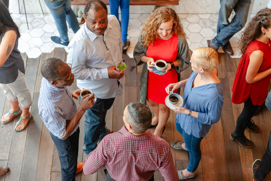 Diverse group enjoying coffee chat.