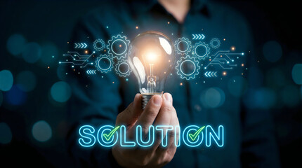 Naklejka premium Hand holding glowing lightbulb with digital solution network for business innovation