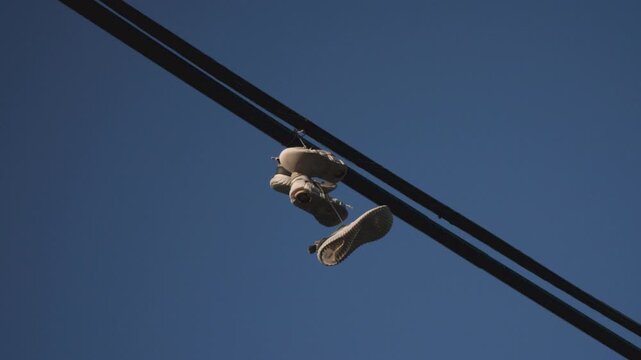 Sneakers hanging on a power line.