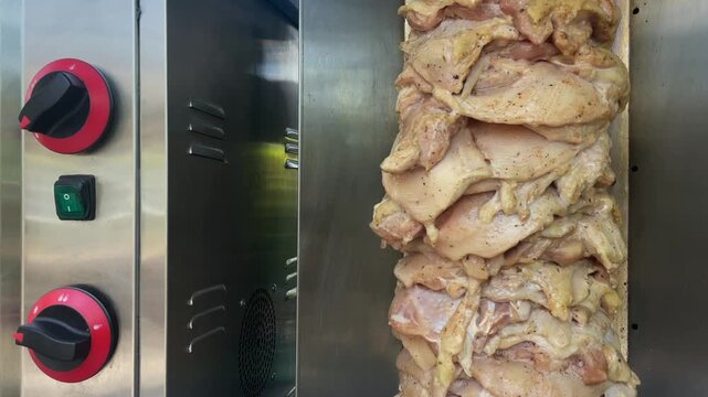 Chicken shawarma meat spinning on the pole