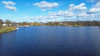 Obraz premium Lake view with historic church in Schleswig Holstein, Germany