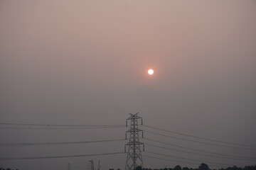 Sunset Silhouette of Power Transmission Tower