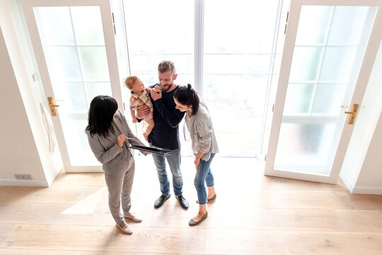 Family viewing new home interior.