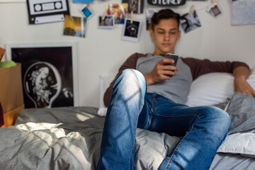 Obraz premium Teen relaxing bedroom phone