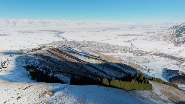 Aerial view of Teplokluchenka (Ak-Suu), Kygyzstan, from nearby mountains. 