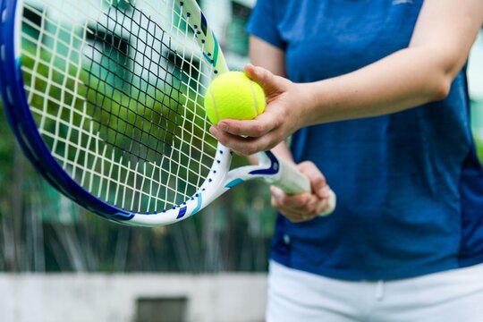 Tennis player preparing serve.