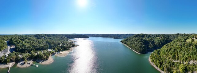 Aerial View of the Lakeside Sunset Marina Resort on Dale Hollow Lake With Highway 111 Bridge, Boats and Forested Shoreline, Calm Water on a Sunny Day, Monroe, Tennessee, USA. © Friedrich