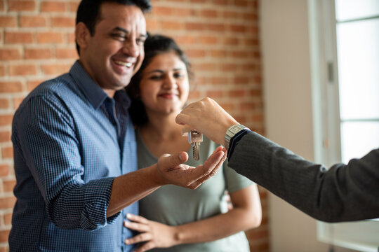 Happy couple receiving keys