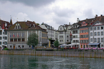 Obraz premium Old buildings facades over canal of Lucerne in Switzerland