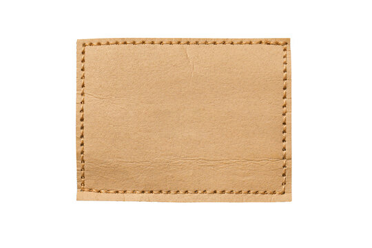 Blank leather patch with stitching isolated on background. Square leather label template with seam border. Natural leather texture badge for branding logo clothing tag or design mockup.