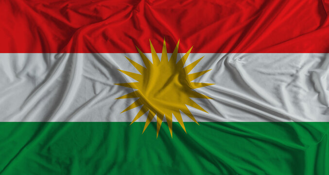 Kurdistan flag with fabric texture background. National flag of Kurdistan with cloth texture