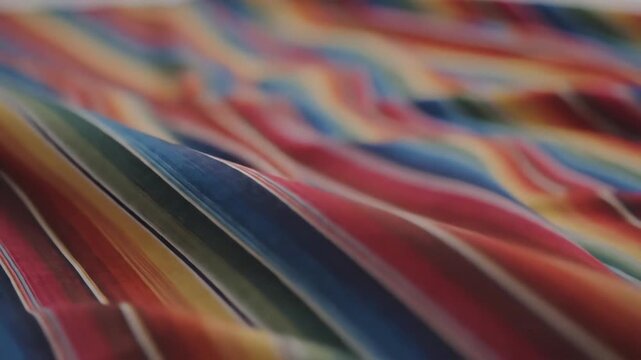 Abstract Colorful Fabric Waves Flowing Seamlessly with Vibrant Stripes.
