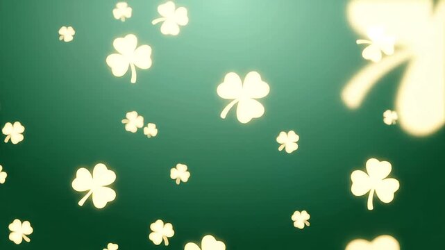 Golden four-leaf clovers falling gently in air with soft green background light