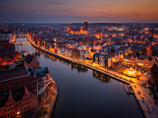 Fototapeta premium Beautiful old town of Gdansk with historic architecture over the Motlawa river at dusk, Poland