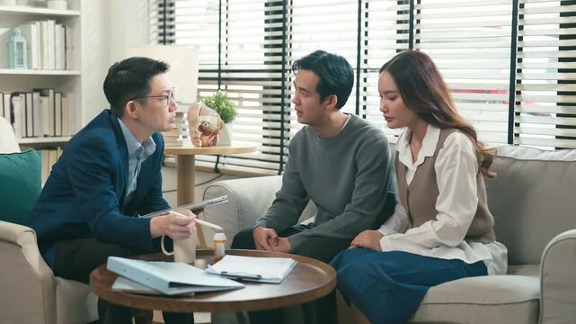 couples therapy session, a marriage counselor consults with a young couple for family therapy, offering relationship counseling, marriage help, family support, anxiety therapy, depression support	