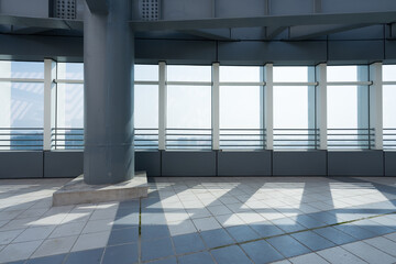 Obraz premium Modern architectural interior scene with window-side light and shadow on tiled floor