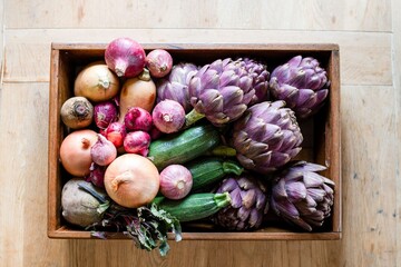 Fresh vegetables in wooden box.