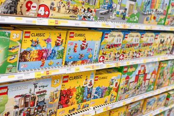 Fototapeta premium Gothenburg, Sweden - november 06 2022: Colorful LEGO toy boxes displayed on retail store shelves.