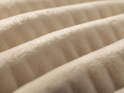 Close-up of creamy white velvet fabric with ridges, soft warm light, minimalist high fashion aesthetic, Moncler x Mercedes style, textured texture - AI-Generated