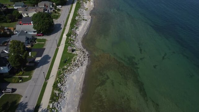 The north shore of Lake Erie at Fort Erie, Ontario, Canada, looking down the waterfront by an aerial from above the shallow waters.