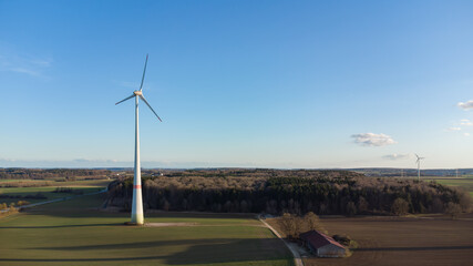 Wind Turbine in the Middle of Farmland – Aerial Drone View © Lajos_Szücs