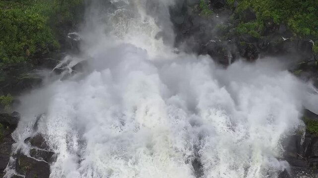 Close Up Aerial View of Powerful Waterfall Rapids andThick Mist