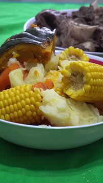 Traditional argentine puchero stew with beef and vegetables, 4K vertical