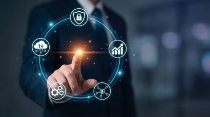 Fototapeta premium A futuristic business technology visualization showing a professional hand activating a circular system of large digital business icons orbiting around a central interaction point.