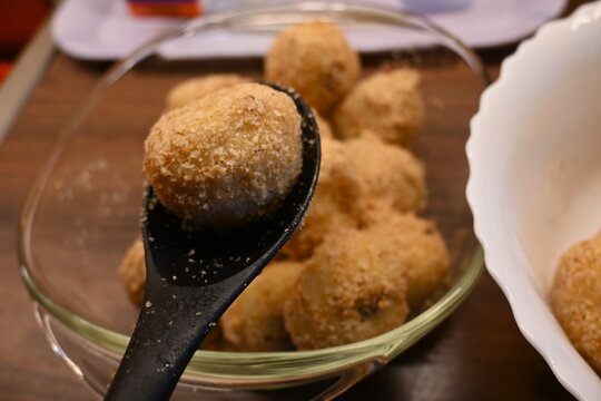Bowl filled with traditional Hungarian plum dumplings. Classic homemade dessert representing traditional cuisine, comfort food and family cooking concepts.