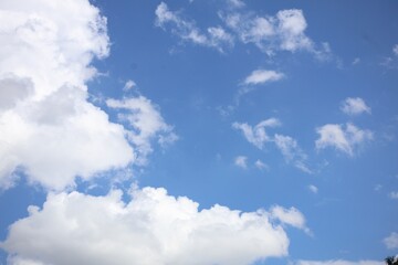 Fototapeta premium Fluffy clouds on blue sky
