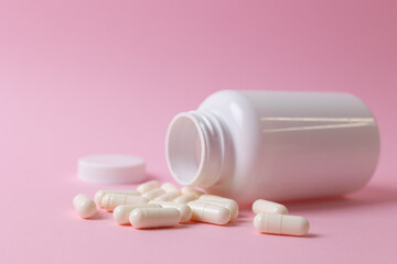 Vitamins On Neutral Background. Assorted Supplement Bottles With Capsules On Plain Backdrop