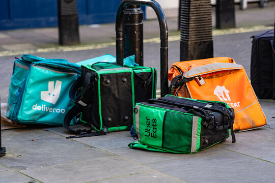 Uber Eats Backpack, Deliveroo, Just Eat Takeaway Food Delivery Thermal Bags On Street, London, England, UK &ndash; March 2026