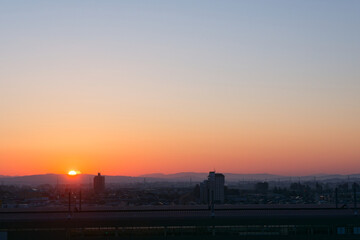 Sunrise Over a Rural Shinkansen Station in Japan