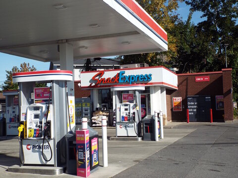 Ottawa, Ontario, Canada-July 20, 2025: The "Pioneer gas station" at 2921 Bank Street features a Snack Express convenience store, CIBC ATM, and Amazon pickup lockers.