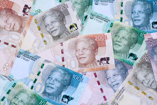 South African rand paper banknotes pile on table. South Africa ZAR currency money bills in big amount. Concept of economics, taxation and banking in South Africa