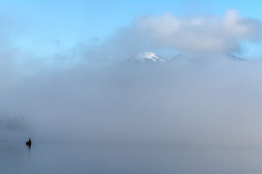 Canada, BC, Vancouver Island, Telegraph Cove.  Fog lays over the face of Nimpkish Lake