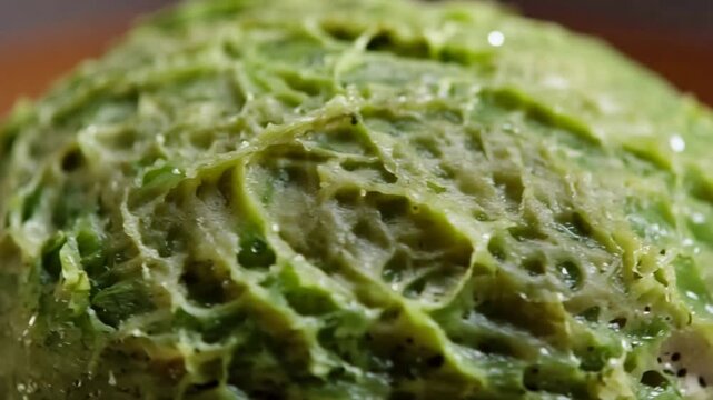 Macro Close Up of Fresh Green Avocado Dip Surface with Unique Organic Texture.