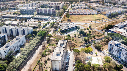 Fototapeta premium Aerial view of the upper-middle-class Sudoeste (Southwest) neighborhood, Blocks 100SW and 301SW and its commercial center. Brasília, Brazil, 2023